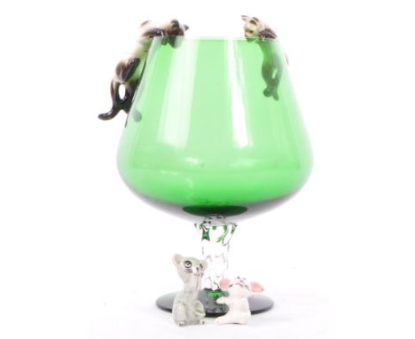 A vintage 20th century large glass wine drink receptacle with tapering body on swirl stem on a circular base. With china cats