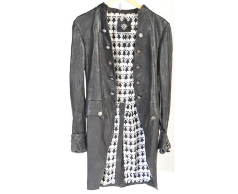 A vintage 20th century black leather coat / jacket. Collarless with skull design material lining. Paula Thomas for TW label p