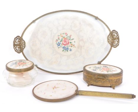 A vintage 20th century French petit point needlework ormolu cased glass vanity dressing table set comprising of vanity pot, t