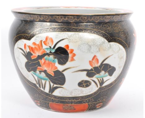 An early 20th century Chinese hand painted ceramic planter. The planter having a black ground with hand painted vignettes of 