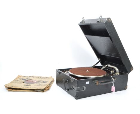 A vintage portable wind up gramophone by Garrard. With link-plate and automatic brake in black crocodile-grained case with li