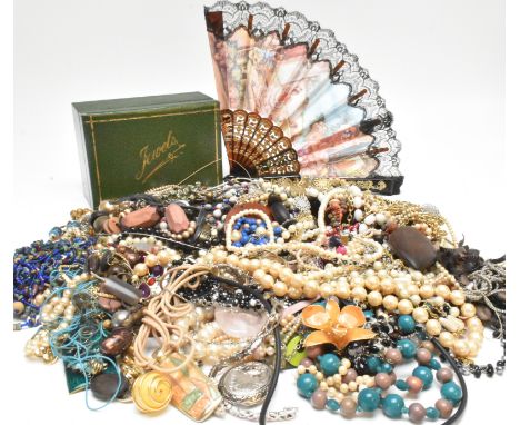 A collection of vintage and modern costume jewellery, jewellery box and fan. The jewellery to include necklaces pendants bead