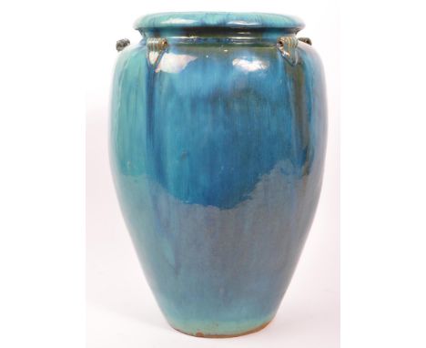 A large late 20th century earthenware floor standing vase. With blue flambé glaze colourway / decoration in the manner of Bur