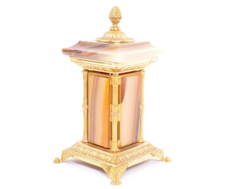 A vintage 20th century onyx and gilt metal cigarette dispenser having acorn finial over pediment top to mechanically influenc