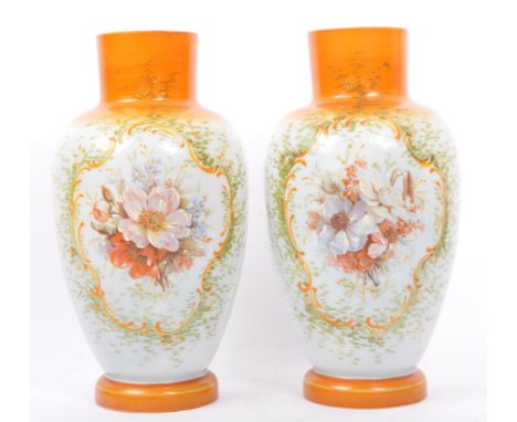 Two matching mid 20th century circa 1940s egg shell ceramic hand painted vases. The lot comprising of matching pair of ovoid 