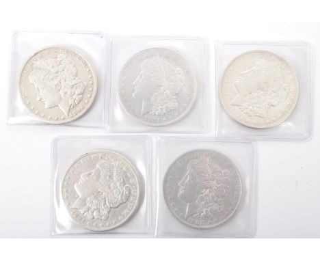 A collection of five Morgan American silver dollars dated 1981, 1900 and 1921. Named after their British engraver, George T. 