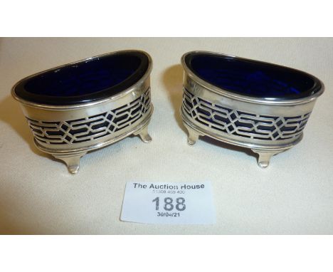 Pair of silver salts with blue glass liners. Hallmarked for Chester 1896 Haseler Brothers