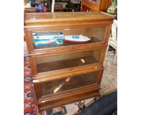 Globe Wernicke oak three-section bookcase with glass up and over doors