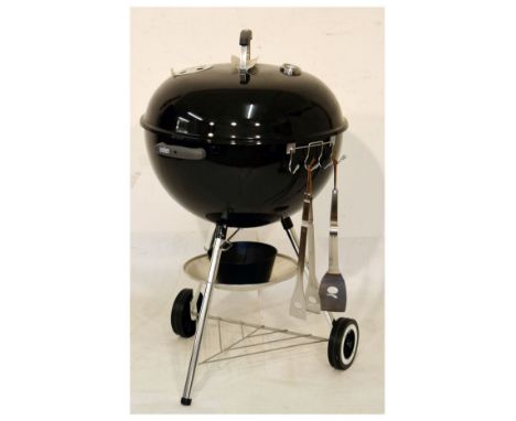 Weber portable barbeque, the domed cover with temperature gauge on tripod base with two wheels   Condition: 