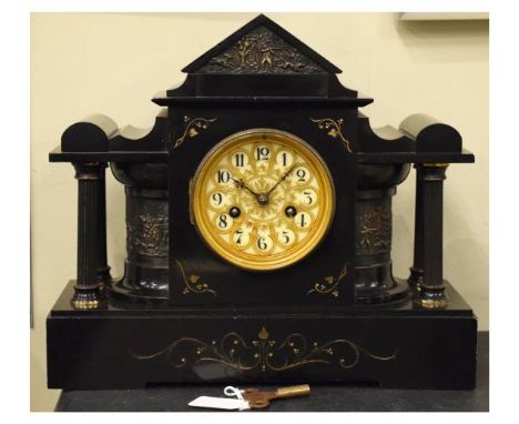 Late 19th Century French black slate mantel clock of architectural form with cellular Arabic dial between quarter columns and