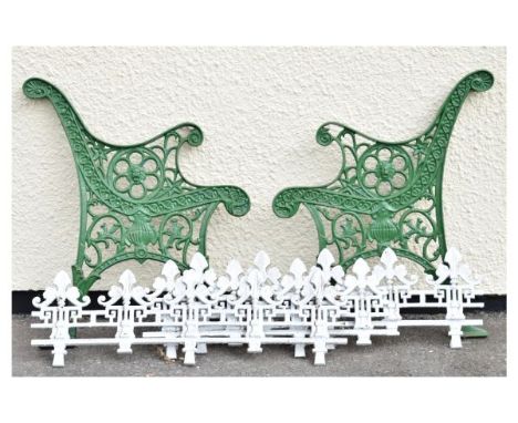 Pair of green painted cast metal garden bench ends of small proportions, together with three sections of white painted cast g