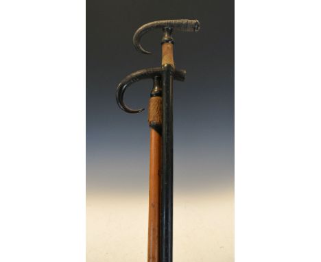 Two early 20th Century walking stick, each handle formed as a mountain goat horn   Condition: 