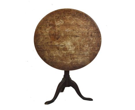 George III oak tripod occasional table, the circular top on a gun barrel stem and tripod support   Condition: 