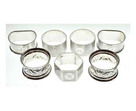 Pair of George VI engine turned silver D shaped napkin rings, Birmingham 1947, another pair of engine turned silver napkin ri