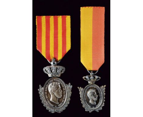 dating: 1871 - 76 provenance: Spain, Two silver medals of reduced shape. Elliptical. On the obverse, head (right) and inscrip