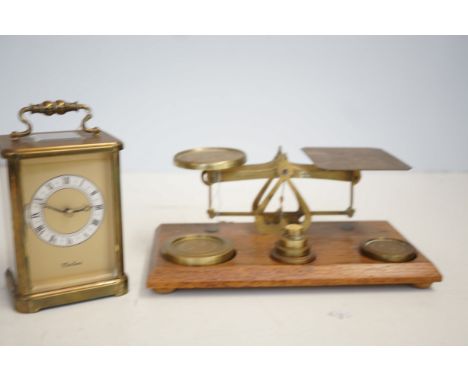 Set of postal scales with weights together with a carriage clock 