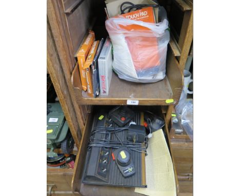 An Atari games console, with two 'paddles' and a joystick, and a selection of games including The Empire Strikes Back, The Re
