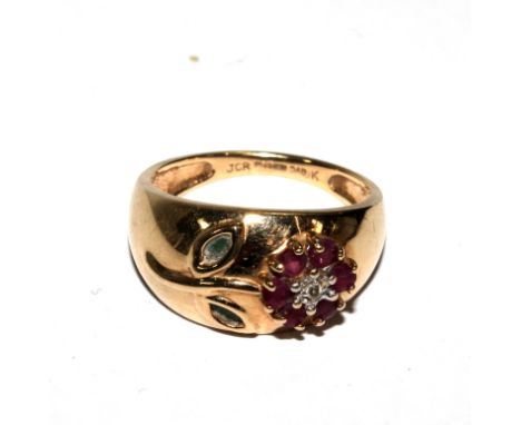 A 9 carat gold ring set with ruby and diamond flower 