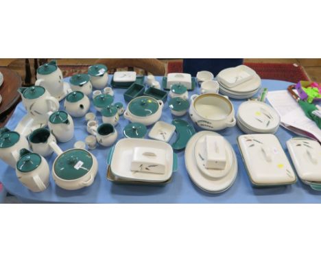 A Denby Stoneware Greenwheat pattern dinner service, including tureens, dishes, butter dishes, pots, jugs, tea cups and plate