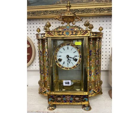 A brass and enamel clock