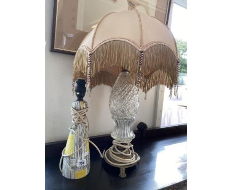 A glass and brass lamp plus another