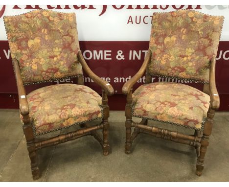 A pair of 19th Century French oak elbow fauteuil chairs 