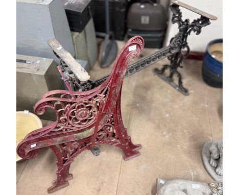 A Victorian cast iron table base and a pair of bench ends 
