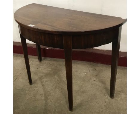 A George III mahogany demi lune console table 