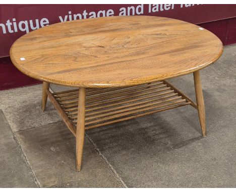 An Ercol Blonde elm and beech oval Windsor coffee table 
