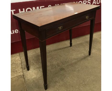 An Edward VII mahogany foldover card table 
