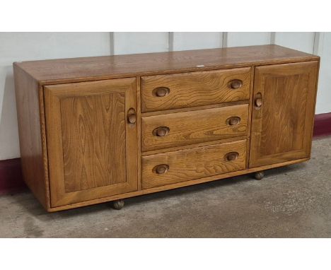 An Ercol Blonde elm Windsor sideboard 