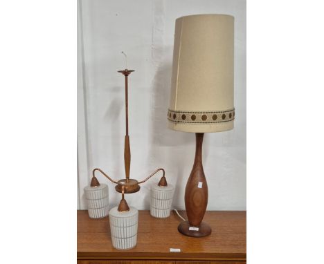 A teak and copper three branch ceiling light and a table lamp 