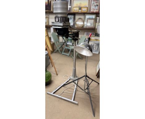 A Johnson photographic enlarger, a Smith Victor industrial light and one other