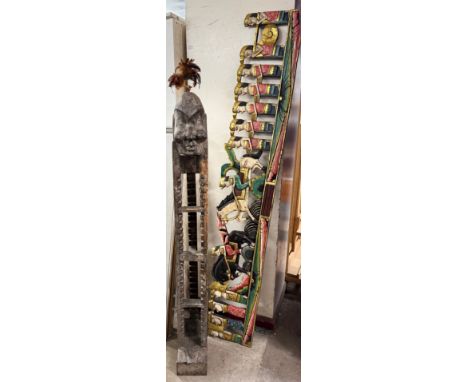An African tribal style CD/DVD rack and an Indonesian wall decoration 