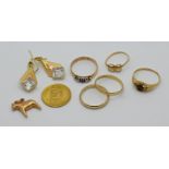 1 Damenring, 1 Paar Ohrringe je GG 18ct. sowie 1 Konv. Schmuck mit Münze "Venezuela", je ungestempel