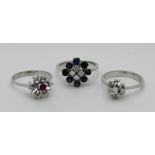 3 Damenringe je WG (2x 18ct., 1x 14ct. wohl mit Rubin (besch.)), je mit Brillanten bis zu ca. 0,2ct.