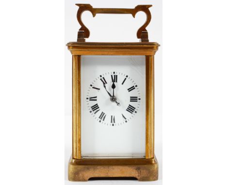A French brass carriage clock, the enamelled dial on a brass, eight day movement, striking to a gong, 12cm high (exc handle)