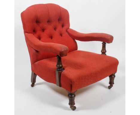 A Victorian button back armchair, late 19th century, with red damask button back and stuff over seat and padded arms, with tu