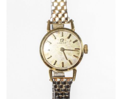 A vintage Ladies 18ct gold cased Omega wristwatch with 17 jewel manual wind movement, the dial with gold baton hour markers, 
