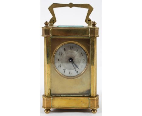 A French brass carriage time piece, the 1 3/4" silvered dial with engine turned centre inside a brass frame, on an eight day 