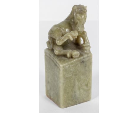 A Chinese green hard stone seal with horse finial, 8.5cm high