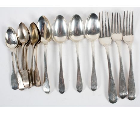 A group of assorted Irish silver flatware, comprising : four Old English pattern dessert spoons, highlighted with wriggle wor