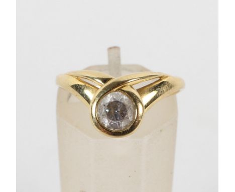 A yellow metal ring set with a circular faceted cut white zircon. No hallmark - stamped 18ct. Size M 2.3 grams