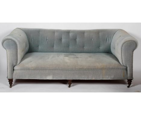 A Victorian Chesterfield sofa, with buttoned blue velvet upholstery and turned front legs, 75cm high x 196cm wide x 95cm deep