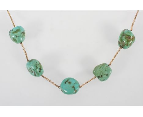 A yellow metal trace link necklace having five interspaced turquoise boulders to the centrepiece. Bolt ring clasp; No hallmar
