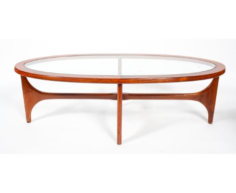 A 1960's vintage Stonehill teak wood oval coffee table with inset glass top