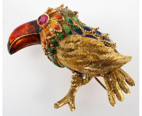 A yellow metal brooch in the style of a bird with enamelled finish and ruby set eye. Replacement base metal pin fitted. No ha