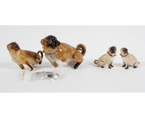 A Meissen (outside decorated) model of a Pug with a blue and gilt bell collar, another Meissen example and a pair of Continen