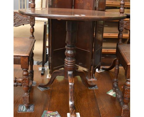 A 19th century tilt top mahogany tripod table and a 19th century mahogany cupboard (2) 