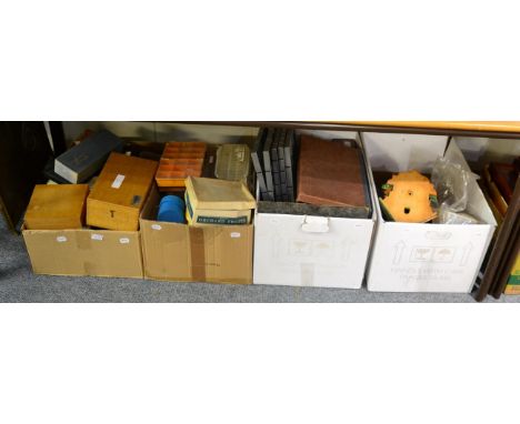 A quantity of watch parts, and tools including a pivoting lathe, a pivot hole loosening tool, a balance timer tool, a Tissot 